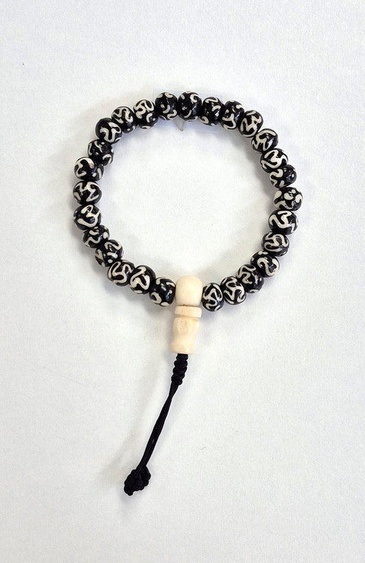 Mala Bracelet - Tibetan Yak Bone Dark with Mantra and White Guru Bead