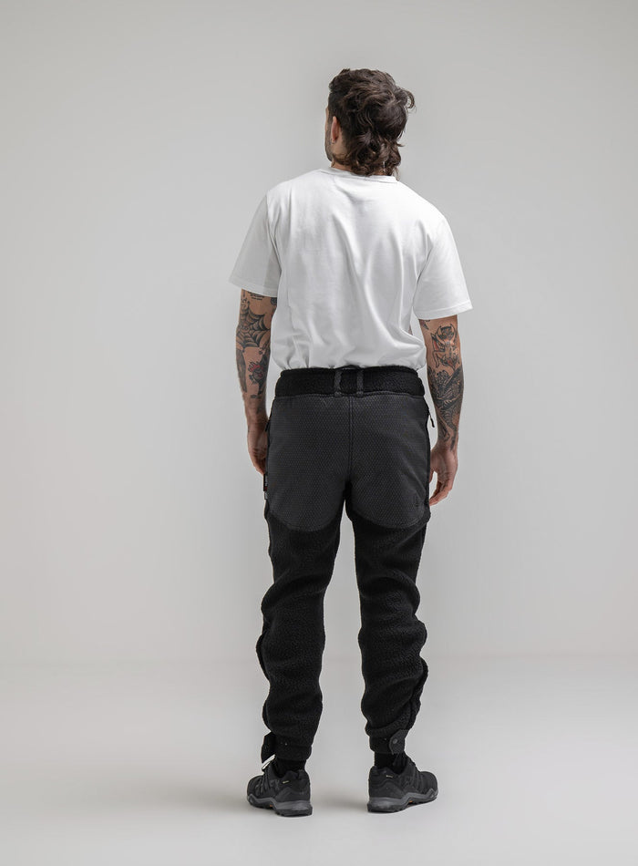 Bernie Is 6ft And Wears Size: M | Hem Studio Image Of Model Wearing Mantra Black Ops Pants In Obsidian Black (SS Model)