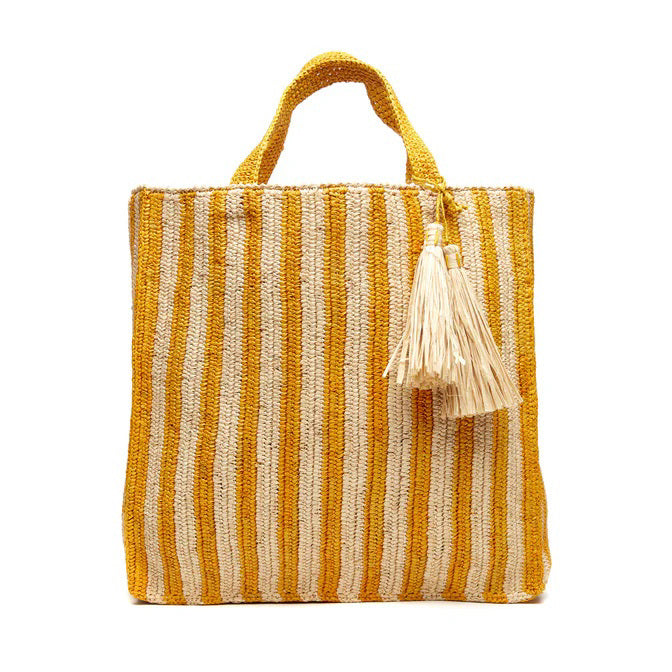 The MAR Y SOL - AMALFI TOTE BAG features yellow and white vertical stripes, two short handles, and cream tassels, making it an ideal beach tote for sunny days.