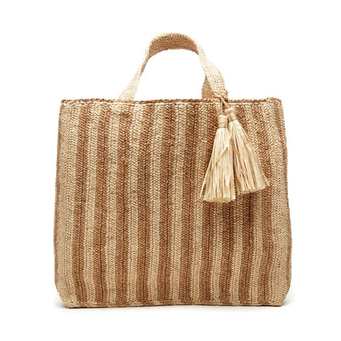 The MAR Y SOL - AMALFI TOTE BAG features yellow and white vertical stripes, two short handles, and cream tassels, making it an ideal beach tote for sunny days.
