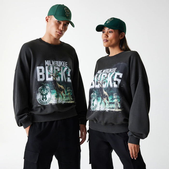 The Male model is wearing Milwaukee Bucks NBA Washed Graphic Grey Oversized Crew Neck Sweater 1