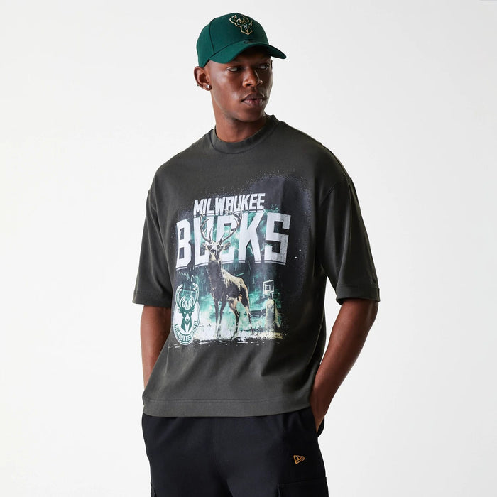 The Male model is wearing Milwaukee Bucks NBA Washed Graphic Grey T-Shirt 3