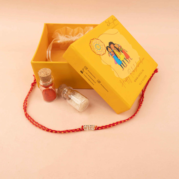 925 pure silver Radha motif rakhi, close-up