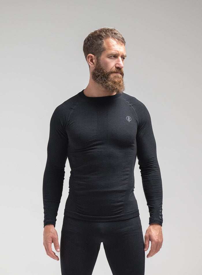 Louis Is 5ft 10" And Wears Size: M | Hem Studio Image Of Model Wearing Mountain Pro Merino Cordura® Base Layer Top In Obsidian Black (SS Model)