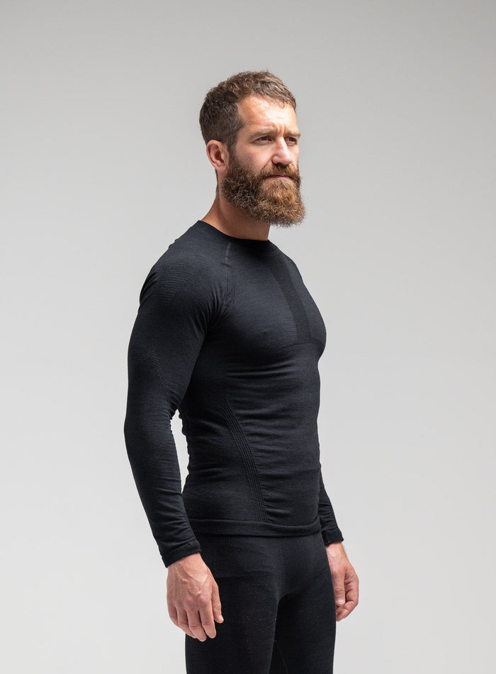 Louis Is 5ft 10" And Wears Size: M | Hem Studio Image Of Model Wearing Mountain Pro Merino Cordura® Base Layer Top In Obsidian Black (SS Model)