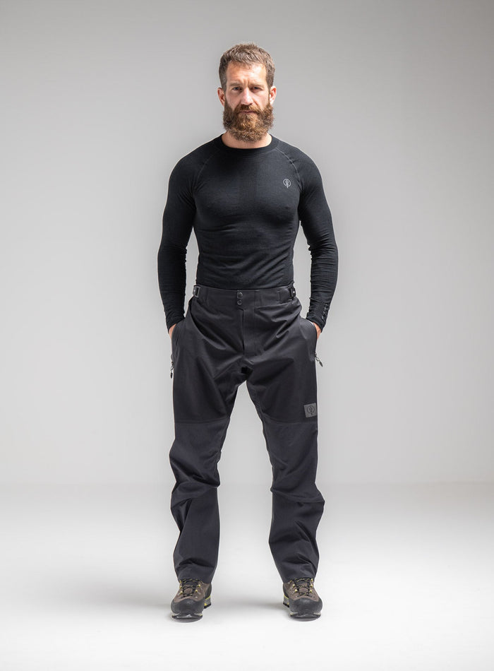 Louis Is 5ft 10" And Wears Size: M | Hem Studio Image Of Model Wearing Mountain Pro Merino Cordura® Base Layer Top In Obsidian Black (SS Model)