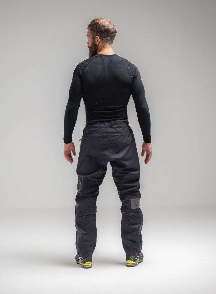Louis Is 5ft 10" And Wears Size: M | Hem Studio Image Of Model Wearing Mountain Pro Merino Cordura® Base Layer Top In Obsidian Black (SS Model)