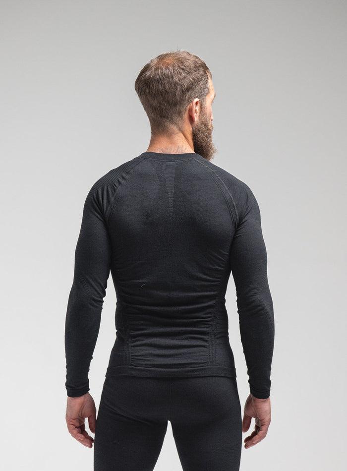 Louis Is 5ft 10" And Wears Size: M | Hem Studio Image Of Model Wearing Mountain Pro Merino Cordura® Base Layer Top In Obsidian Black (SS Model)