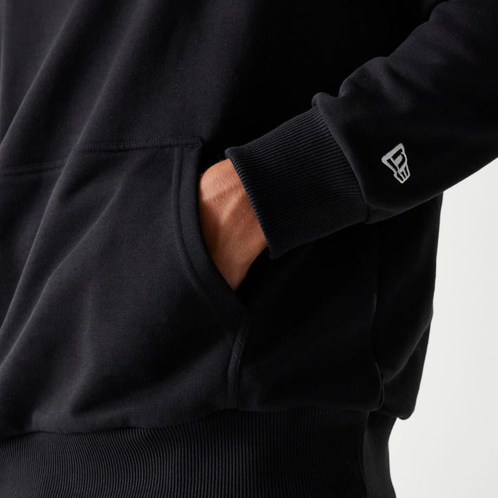 The Male model is wearing Netflix Squid Game Black Oversized Pullover Hoodie 7