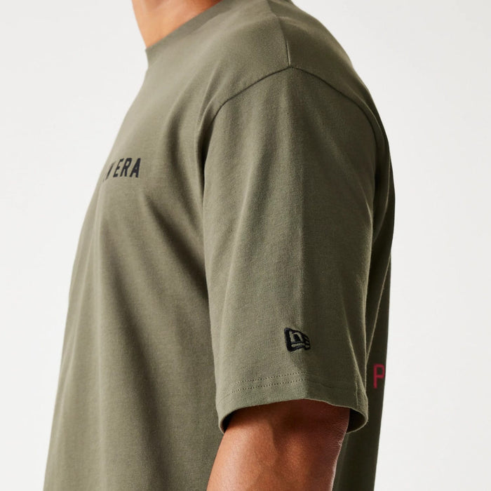 The Male model is wearing New Era Animal Graphic Green Oversized T-Shirt 5