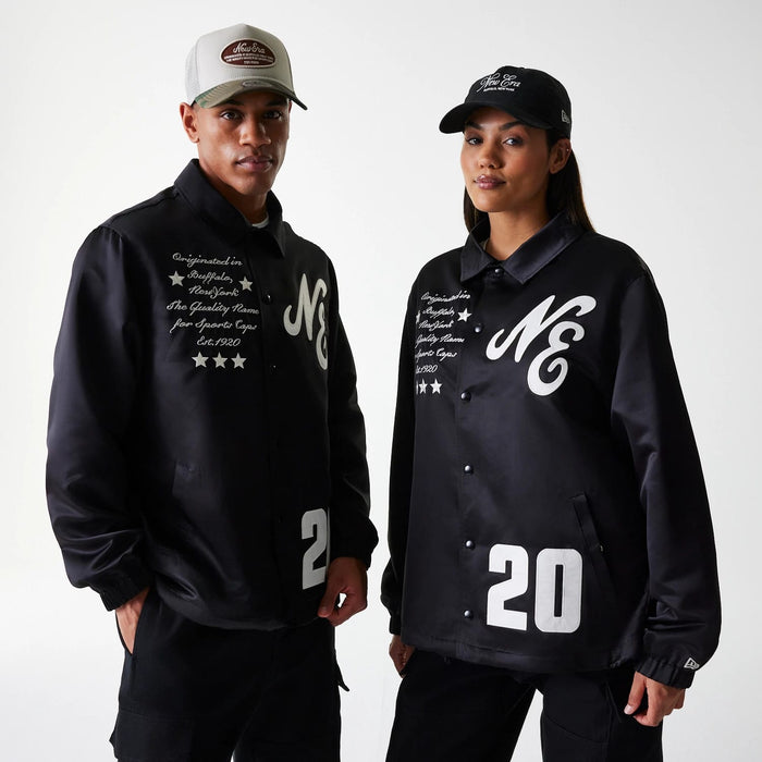 The Male model is wearing New Era Black Coaches Jacket 1