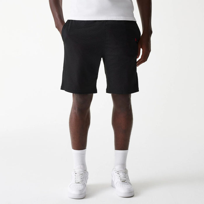 The Male model is wearing New Era Black Mesh Shorts 1