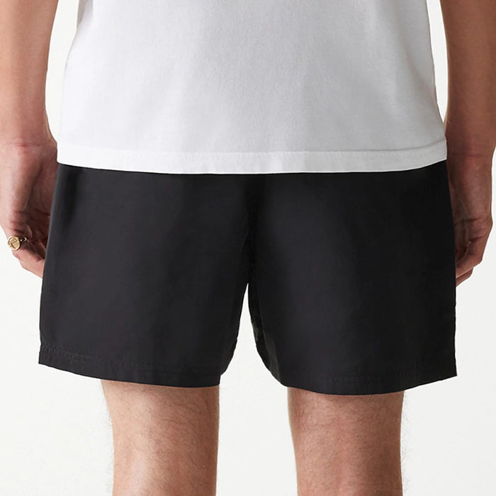 The Male model is wearing New Era Black Swim Shorts 6