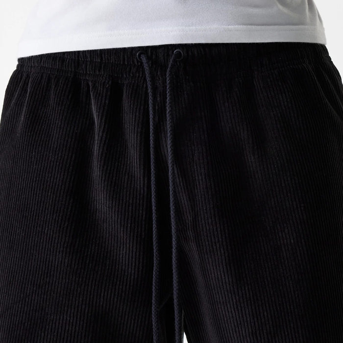 The Male model is wearing New Era Cord Black Shorts 3