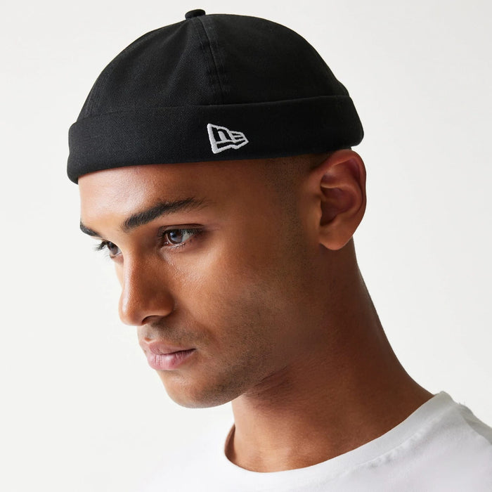 This is a Cotton Twill Docker Black Skull Knit Beanie Hat 1