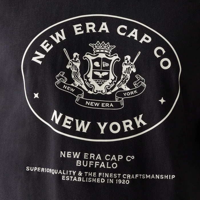 The Male model is wearing New Era Crest Black Oversized T-Shirt 4