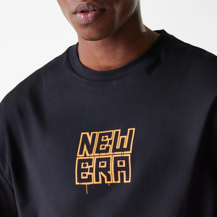 The Male model is wearing New Era Graffiti Graphic Black Oversized T-Shirt 7
