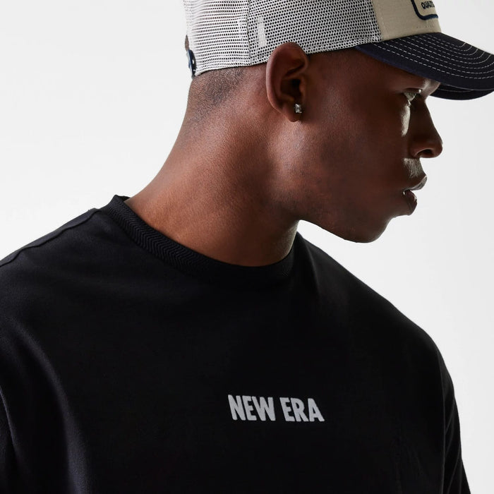 The Male model is wearing New Era Graphic Black Oversized T-Shirt 5