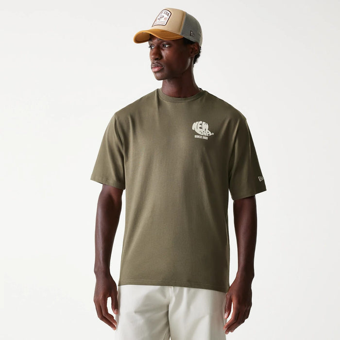 The Male model is wearing New Era Graphic Green Oversized T-Shirt 1