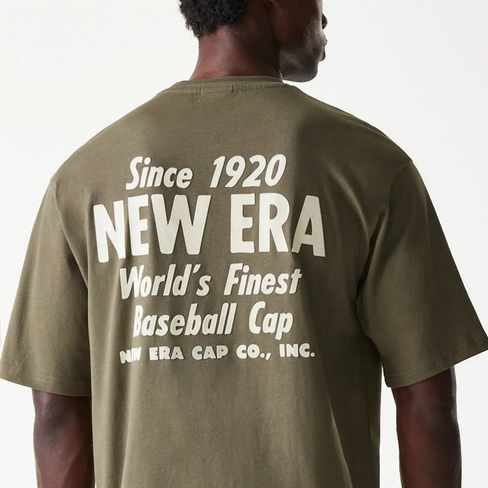 The Male model is wearing New Era Graphic Green Oversized T-Shirt 4