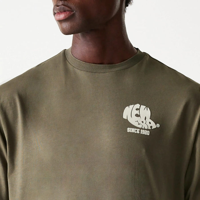 The Male model is wearing New Era Graphic Green Oversized T-Shirt 6