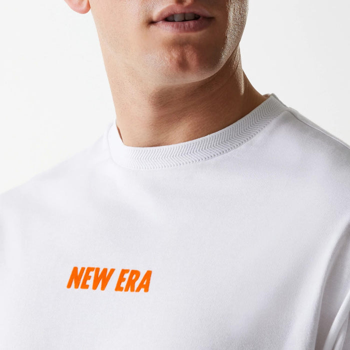 The Male model is wearing New Era Graphic White Oversized T-Shirt 5