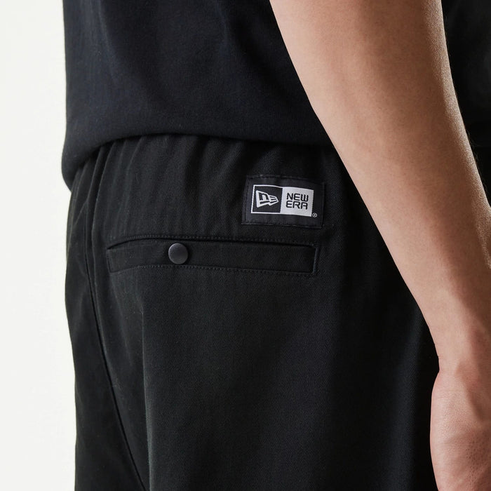 The Male model is wearing New Era Japan Woven Black Shorts 5