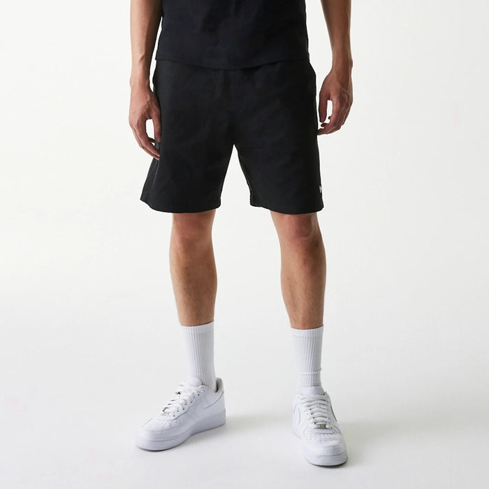 The Male model is wearing New Era Japan Woven Black Shorts 8