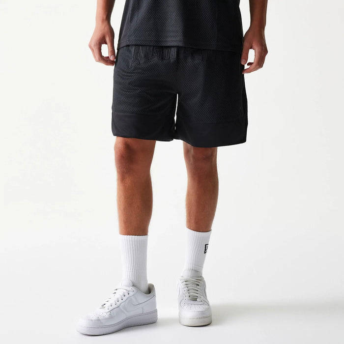 The Male model is wearing New Era Mesh Black Shorts 1