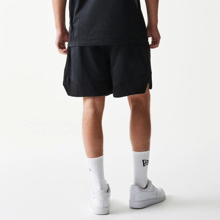 The Male model is wearing New Era Mesh Black Shorts 2