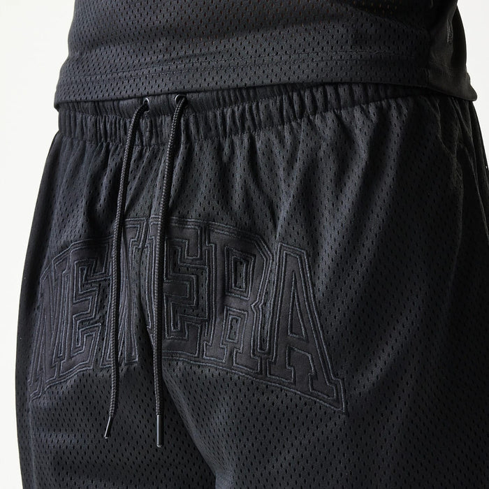 The Male model is wearing New Era Mesh Black Shorts 4