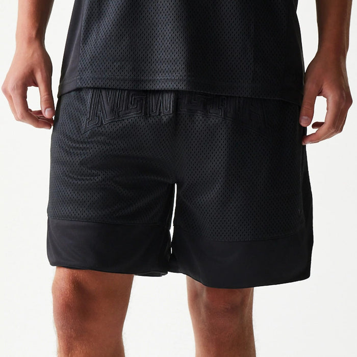 The Male model is wearing New Era Mesh Black Shorts 5
