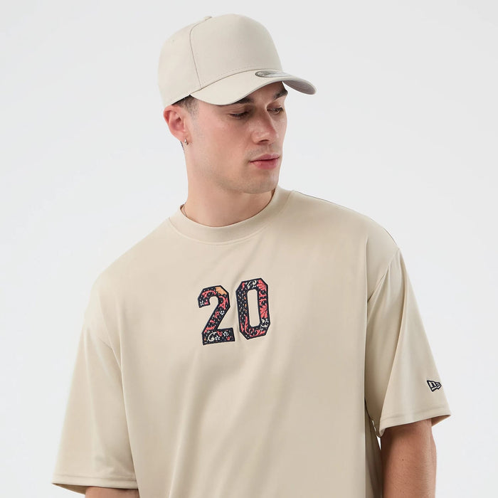 The Male model is wearing New Era Mesh Infill Light Beige Oversized T-Shirt 6