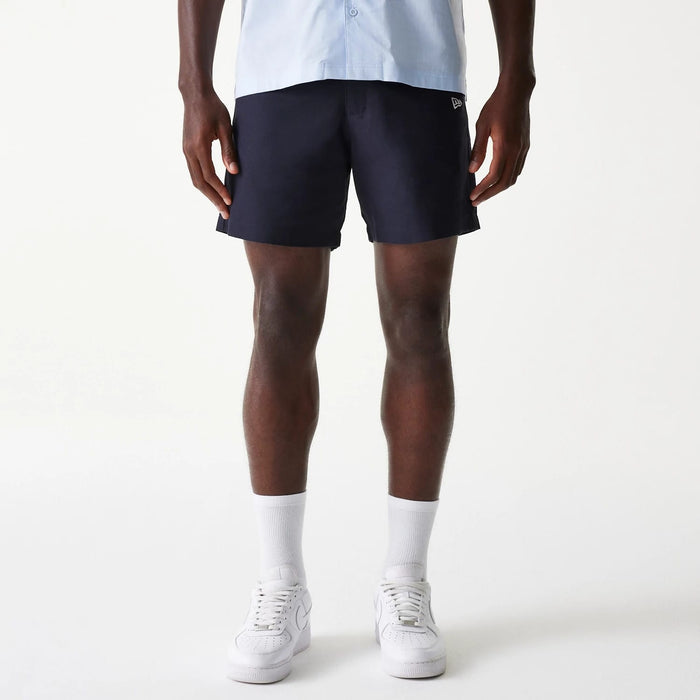 The Male model is wearing New Era Navy Chino Shorts 1