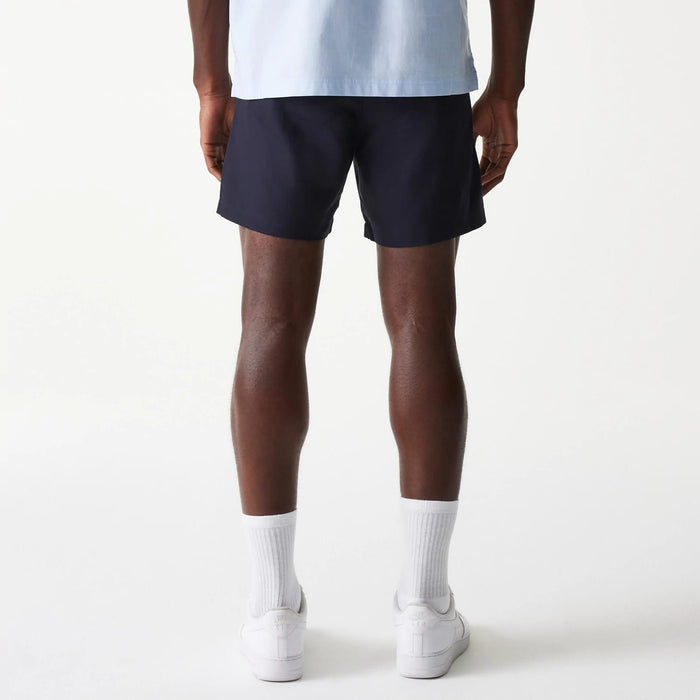 The Male model is wearing New Era Navy Chino Shorts 2