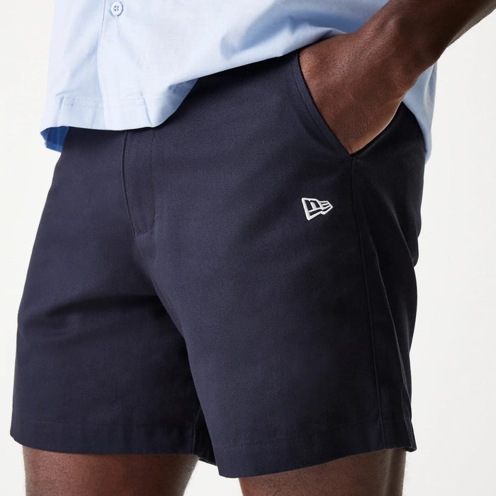 The Male model is wearing New Era Navy Chino Shorts 3