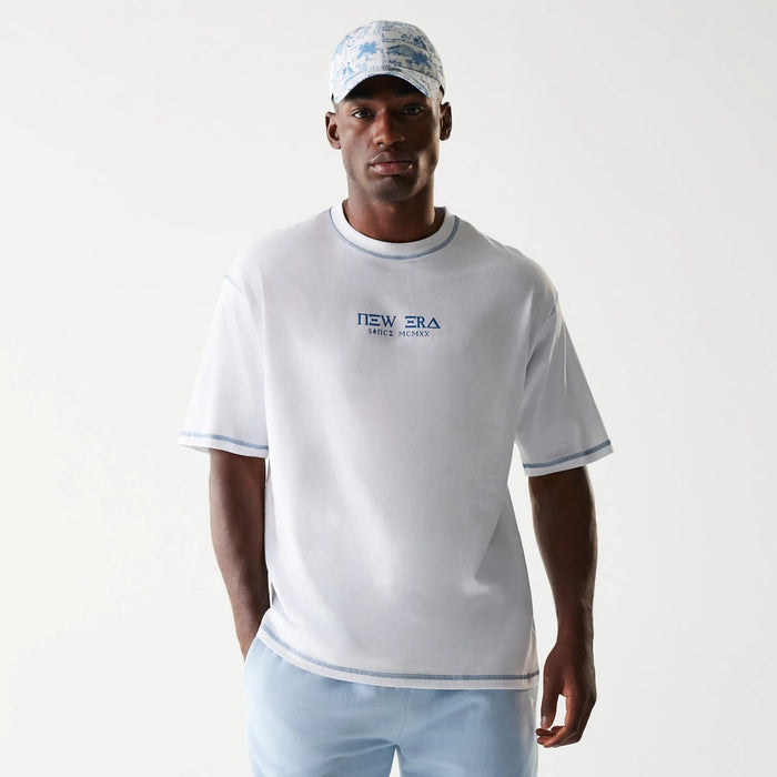 The Male model is wearing New Era Orthodox Church White Oversized T-Shirt 1