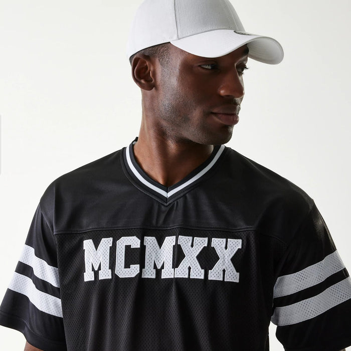 The Male model is wearing New Era Retro Sports Black Mesh Jersey 3