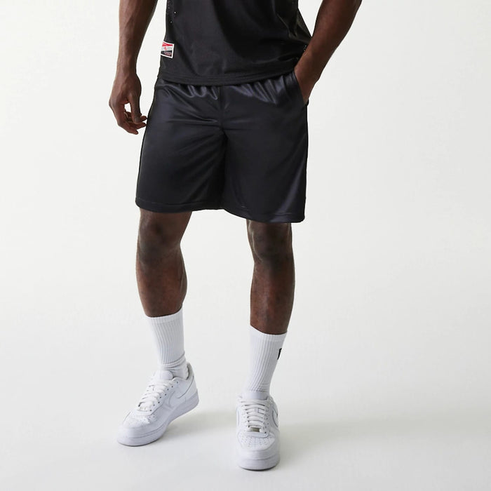 The Male model is wearing New Era Retro Sports Black Mesh Shorts 4