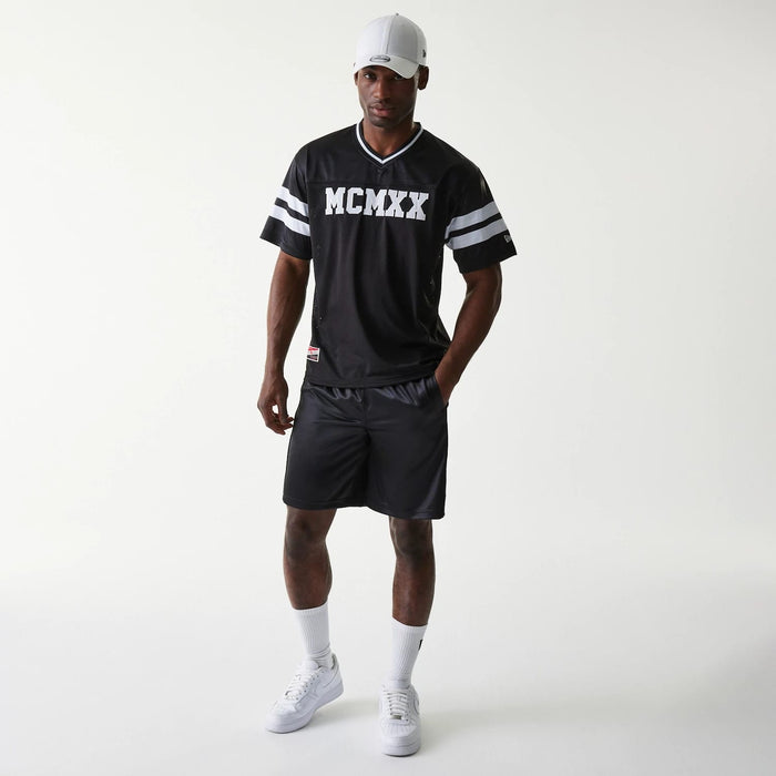 The Male model is wearing New Era Retro Sports Black Mesh Shorts 6
