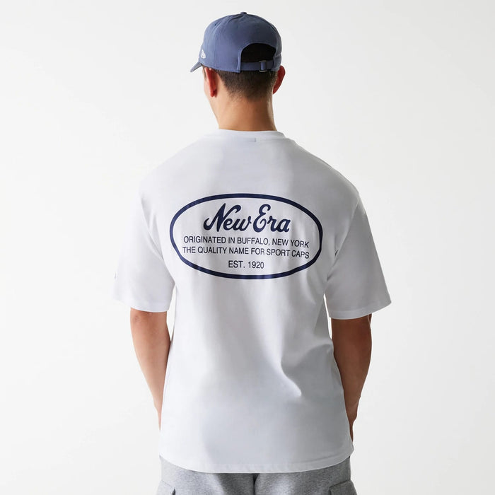 The Male model is wearing New Era Trucker Patch White Oversized T-Shirt 2