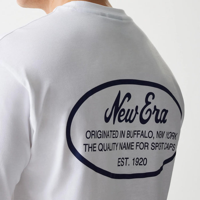 The Male model is wearing New Era Trucker Patch White Oversized T-Shirt 6