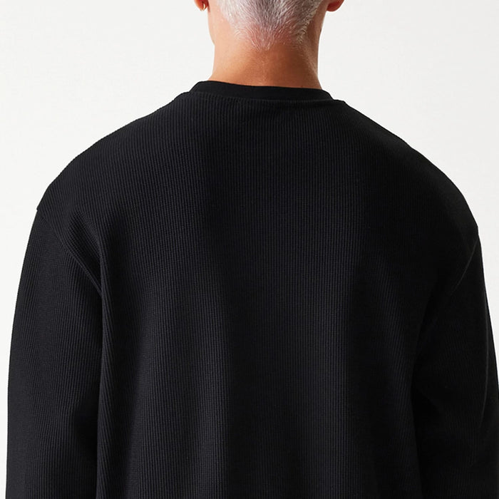 The Male model is wearing New Era Waffle Black Oversized Crew Neck Sweater 6