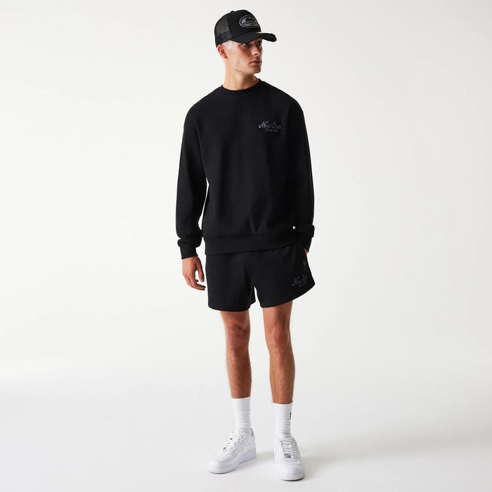 The Male model is wearing New Era Waffle Black Oversized Crew Neck Sweater 7