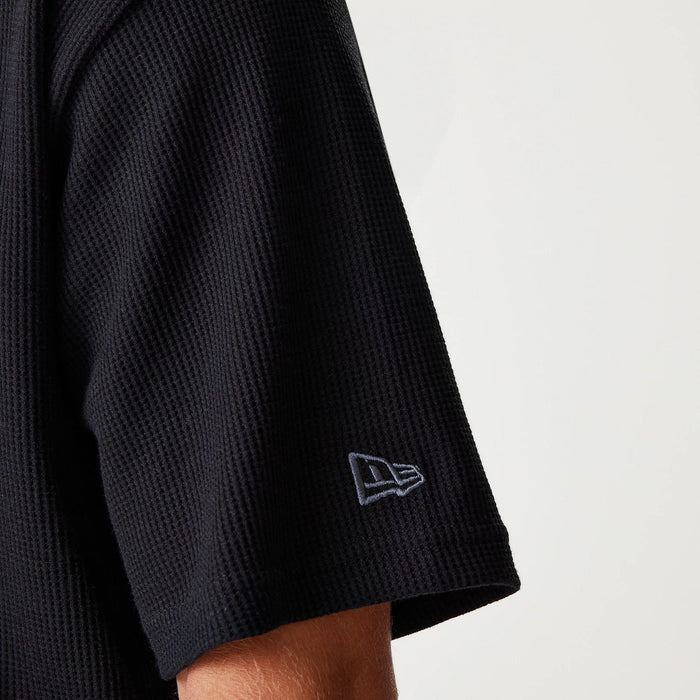 The Male model is wearing New Era Waffle Black Oversized T-Shirt 8