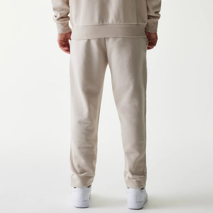 The Male model is wearing New York Yankees MLB League Essential Cream Joggers 2