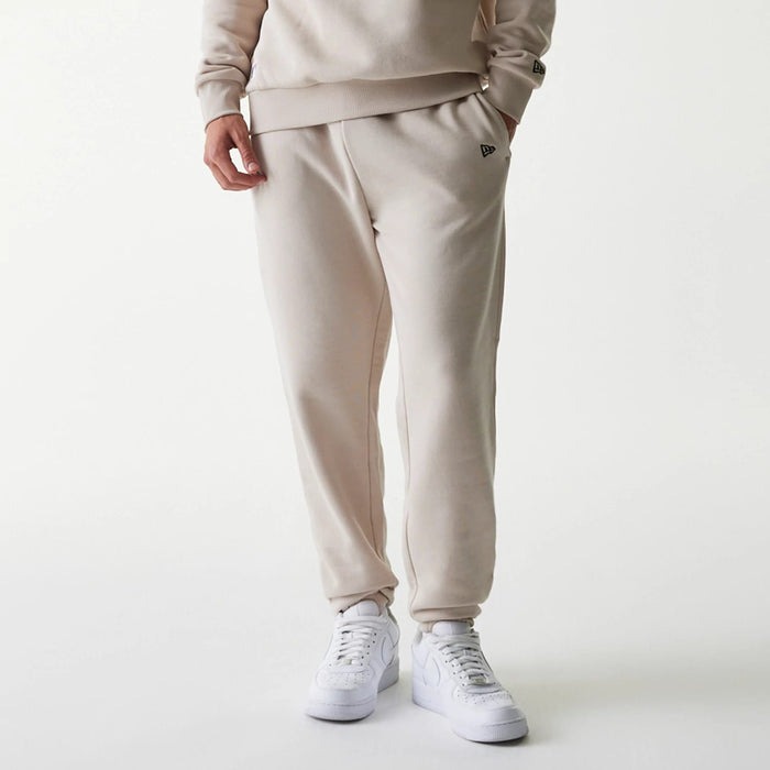 The Male model is wearing New York Yankees MLB League Essential Cream Joggers 4