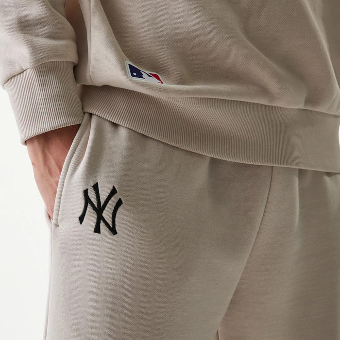 The Male model is wearing New York Yankees MLB League Essential Cream Joggers 6