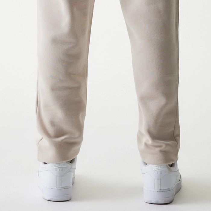 The Male model is wearing New York Yankees MLB League Essential Cream Joggers 7