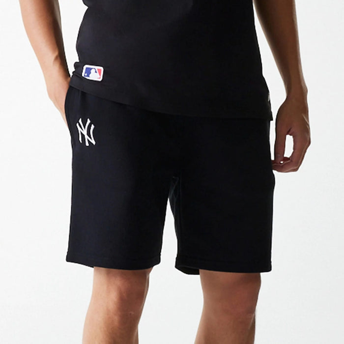 The Male model is wearing New York Yankees MLB League Essential Black Shorts 3